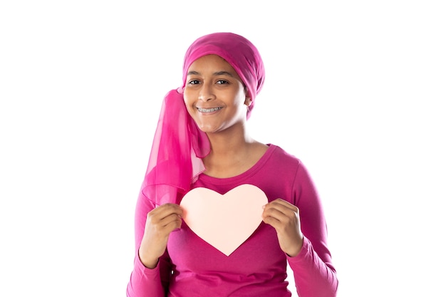 Young beautiful African woman wearing pink headscarf isolated on a white background