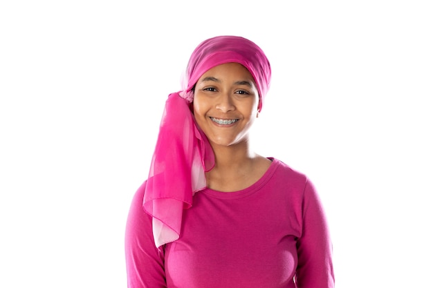 Young beautiful African woman wearing pink headscarf isolated on a white background