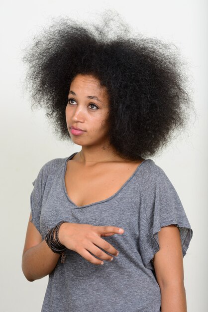 young beautiful African woman with Afro hair on white