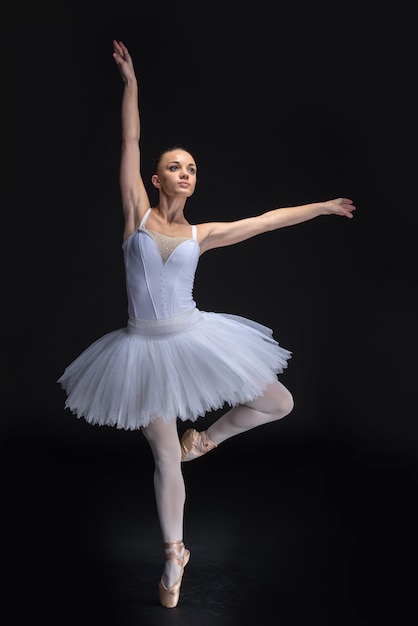 Young beautiful ballet dancer is posing