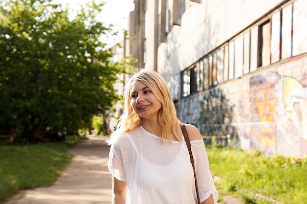 Young beautiful blonde on the street of urban art space