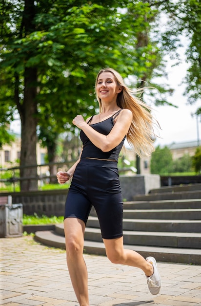 a young beautiful blonde woman runs up the stairs