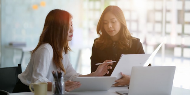 young beautiful businesswoman discussing the project together in modern office