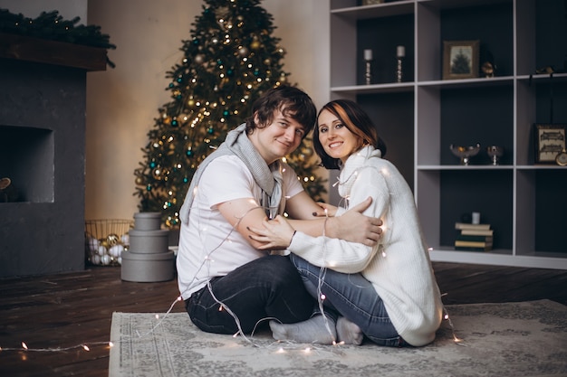 Young beautiful couple celebrating Christmas