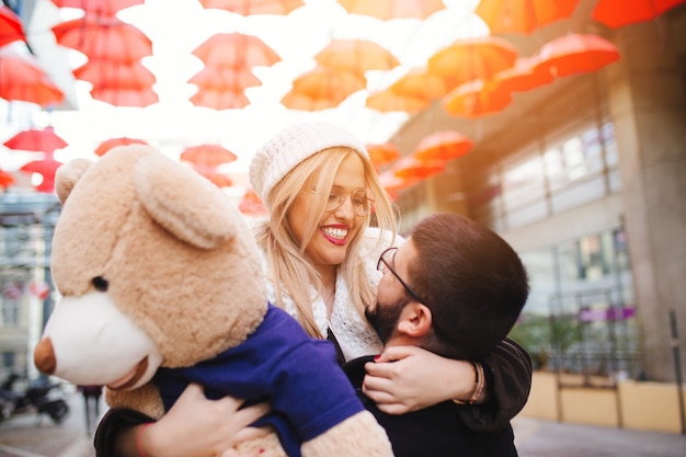 Young beautiful couple enjoying city walk at Valentine's day.