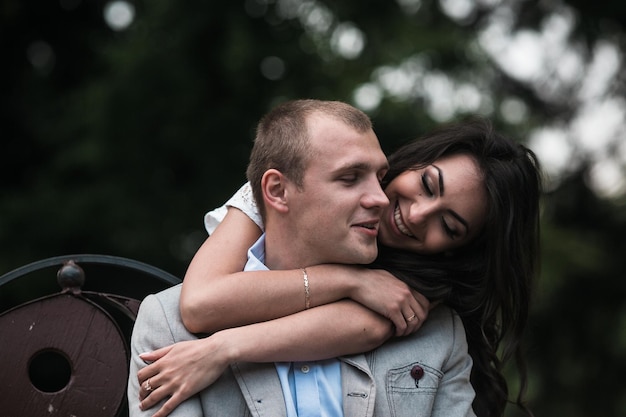 Young and beautiful European couple having a great time on the background of the city