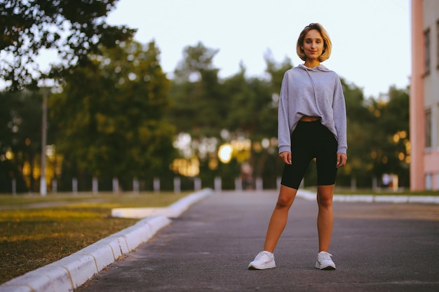 young beautiful girl athlete A young girl is engaged in morning exercises vintage photo processing