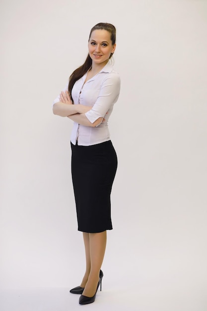 Young beautiful girl in casual clothes. The student prepares for the session.