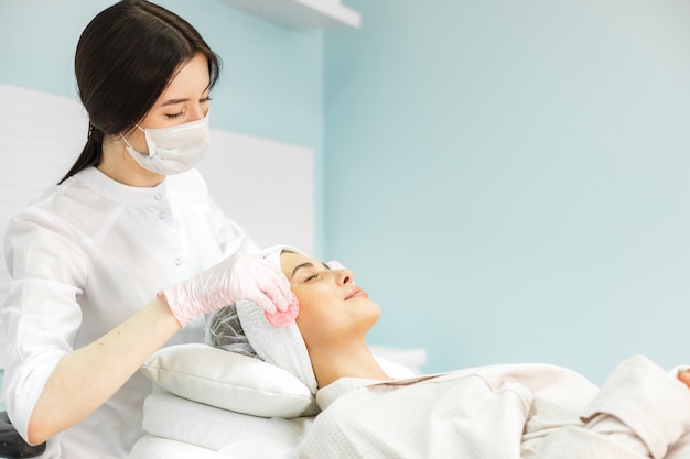 Young and beautiful girl in the clinic of natural beauty