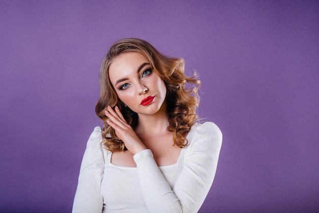 A young beautiful girl shows emotions and smiles