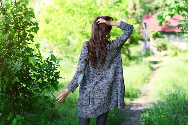 Young beautiful girl walking in park