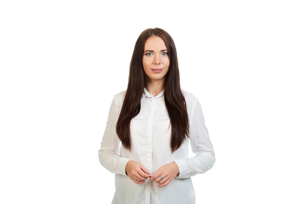 Young beautiful girl in a white shirt on a white background