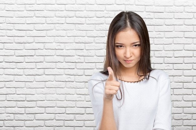 Young beautiful happy caucasian woman pointing on you