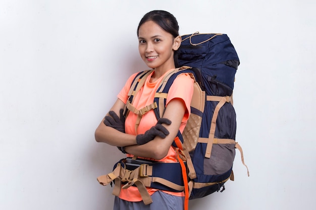 Young beautiful hiker asian woman with a backpack isolated on white background