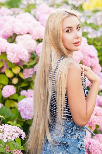 Young beautiful hipster woman in trendy summer clothes.