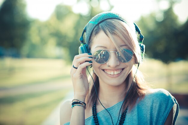 young beautiful model woman listening music