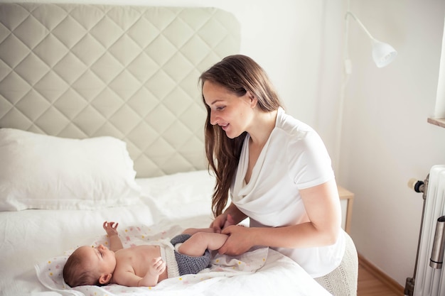 Young beautiful mother holds a baby