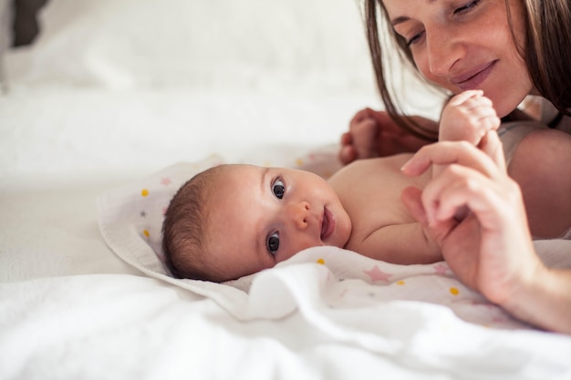 Young beautiful mother holds a baby