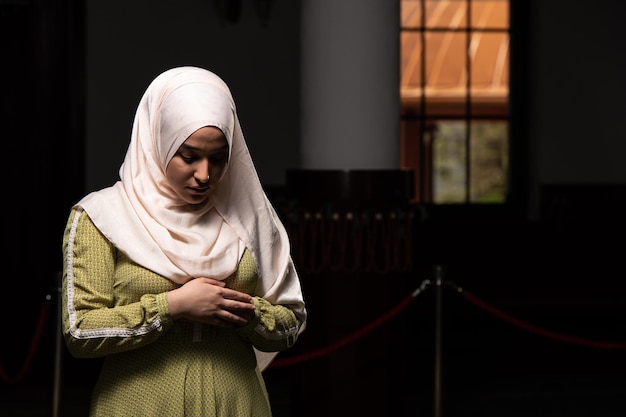 Young Beautiful Muslim Woman Praying in Mosque