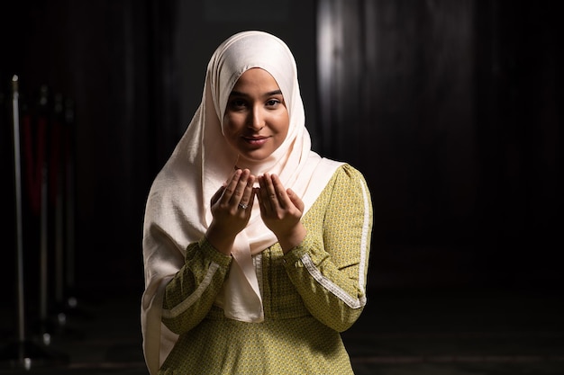 Young Beautiful Muslim Woman Praying in Mosque