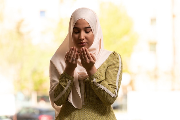 Young Beautiful Muslim Woman Praying in Mosque