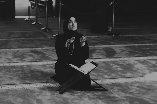 Young Beautiful Muslim Woman Praying in Mosque