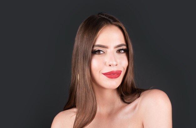 Young beautiful sensual woman woman with sexy lips fashion beauty portrait on studio background