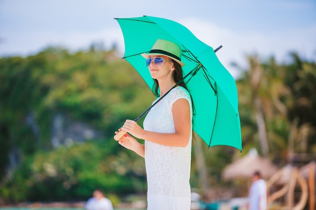 Young beautiful woman on the beach vacation