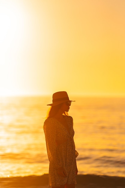 Young beautiful woman on the beach vacation