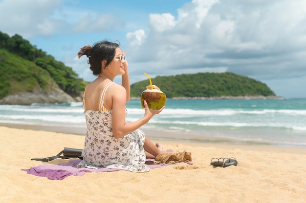 Young Beautiful woman in Bikini enjoying and relaxing on the beach