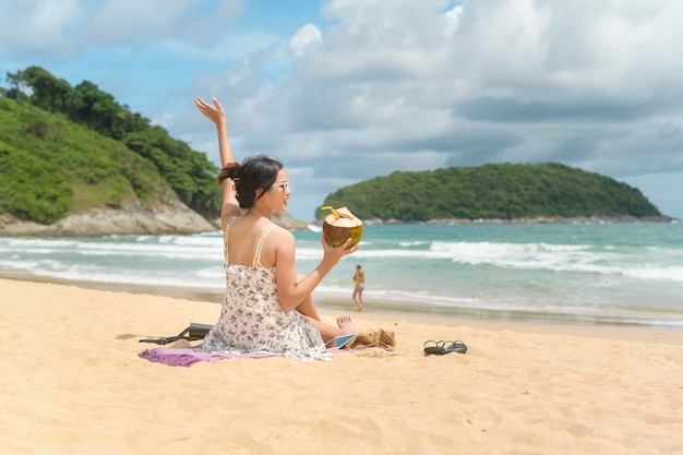 Young Beautiful woman in Bikini enjoying and relaxing on the beach