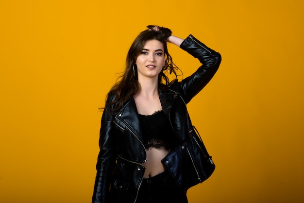 Young beautiful woman in a black leather jacket