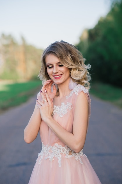 Young beautiful woman in blooming garden. Bride.