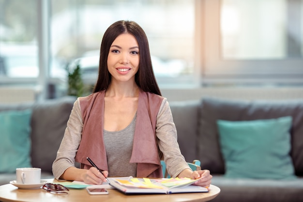 Young beautiful woman in cafe