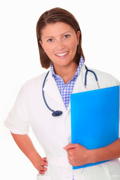 a young beautiful woman doctor with stethoscope and some documents smiling over white