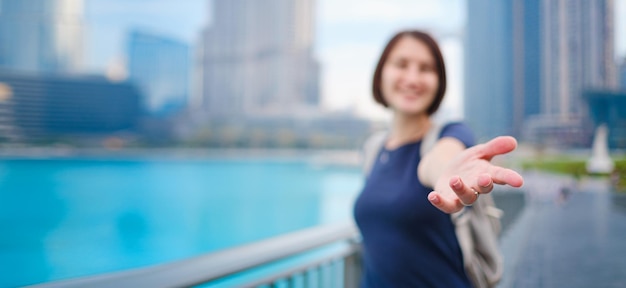 Young beautiful woman enjoying the view of Dubai downtown