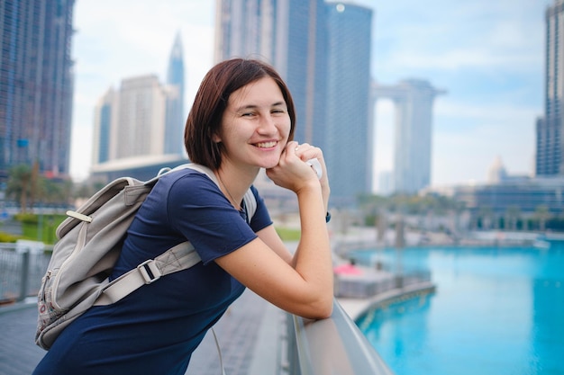 Young beautiful woman enjoying the view of Dubai downtown