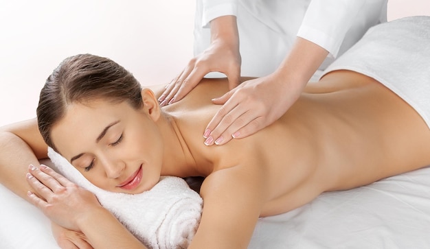 Young beautiful woman having treatment in spa salon