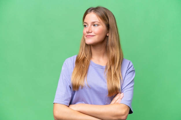 Young beautiful woman over isolated background looking to the side