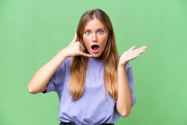 Young beautiful woman over isolated background making phone gesture and doubting