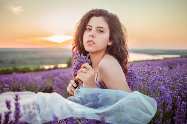 Young beautiful woman in a lavender field