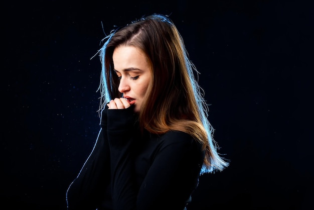 Young beautiful woman model Portrait of pretty lady on dark background