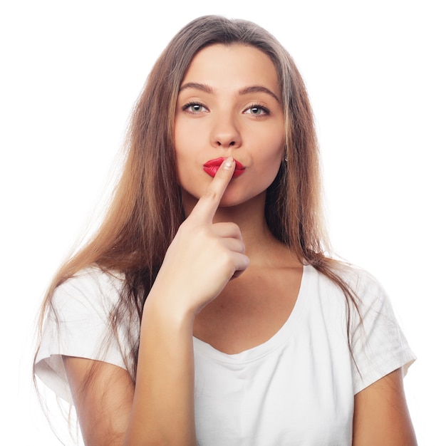 Young beautiful woman posing with white t-shirts, ower white background