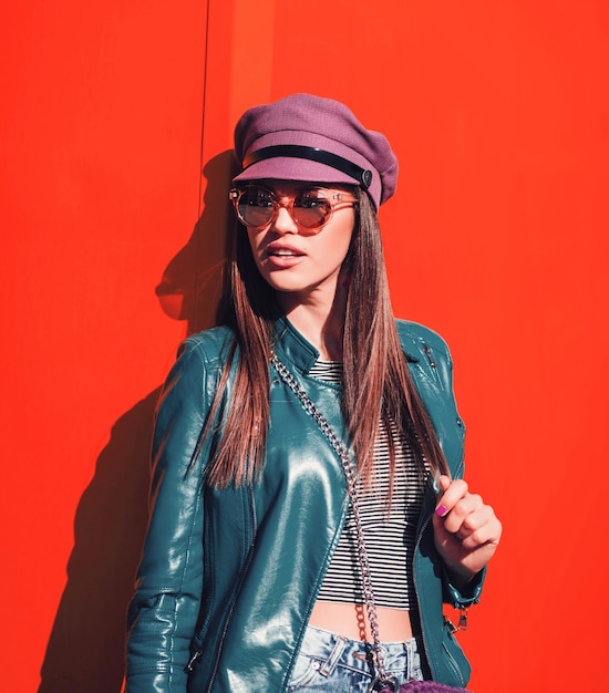 Young beautiful woman on red background