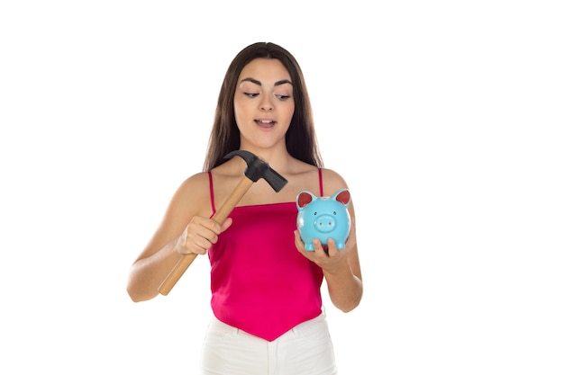 Young beautiful woman standing with piggy bank money box