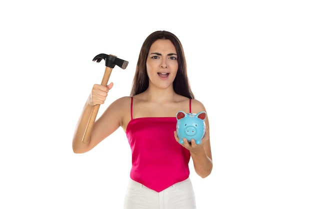 Young beautiful woman standing with piggy bank money box