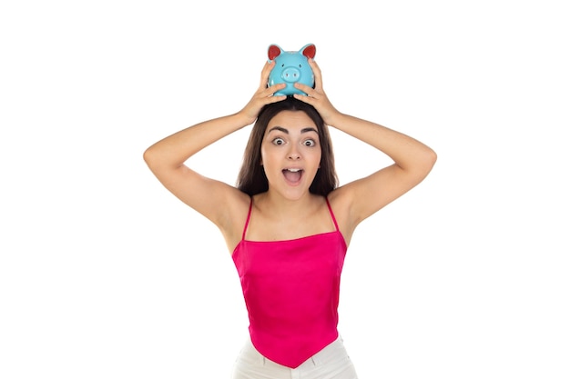 Young beautiful woman standing with piggy bank money box