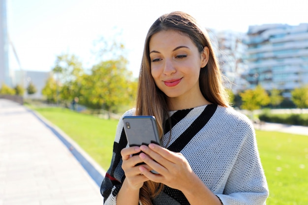 Young beautiful woman using a smartphone