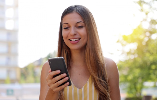 Young beautiful woman using a smartphone