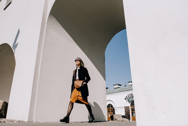 Young beautiful woman walking in street